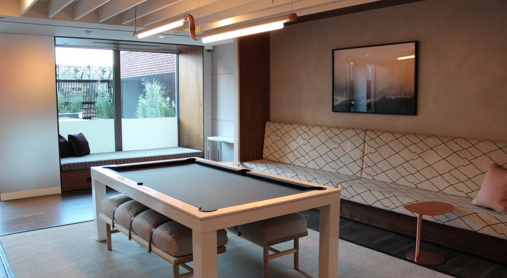 a room with a table and chairs