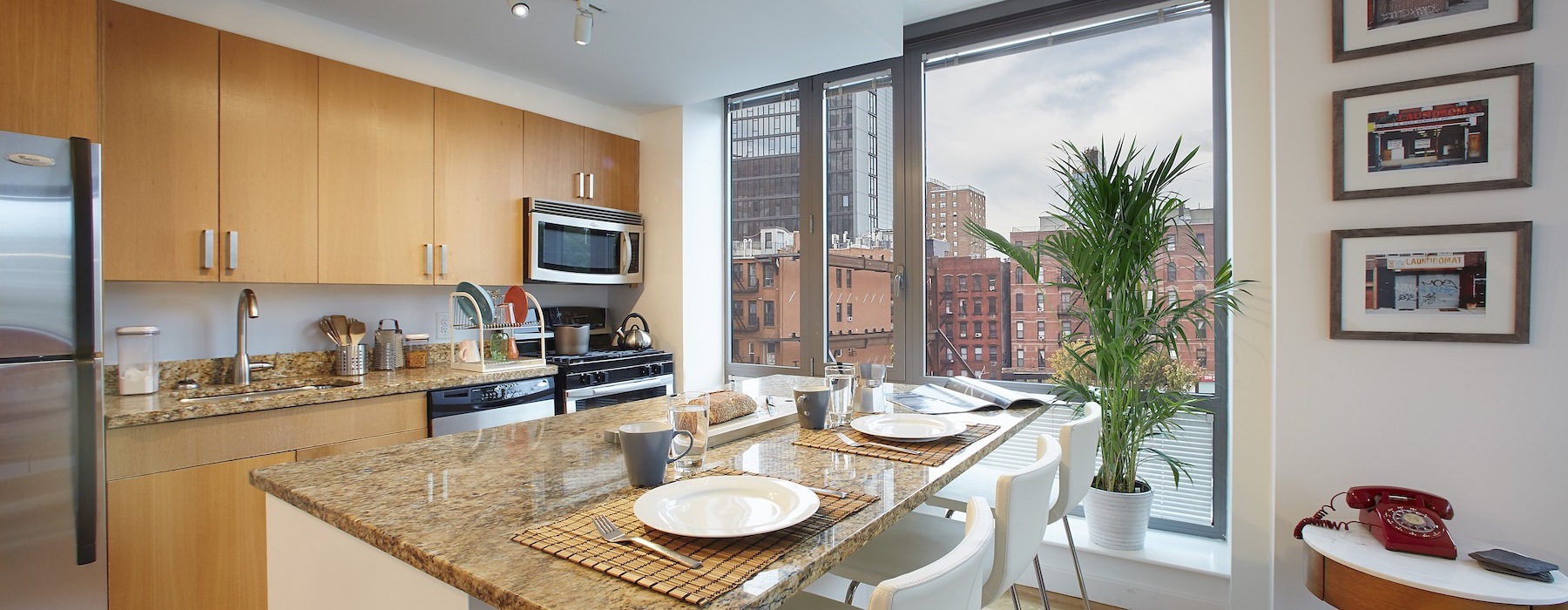 a kitchen with an island and chairs