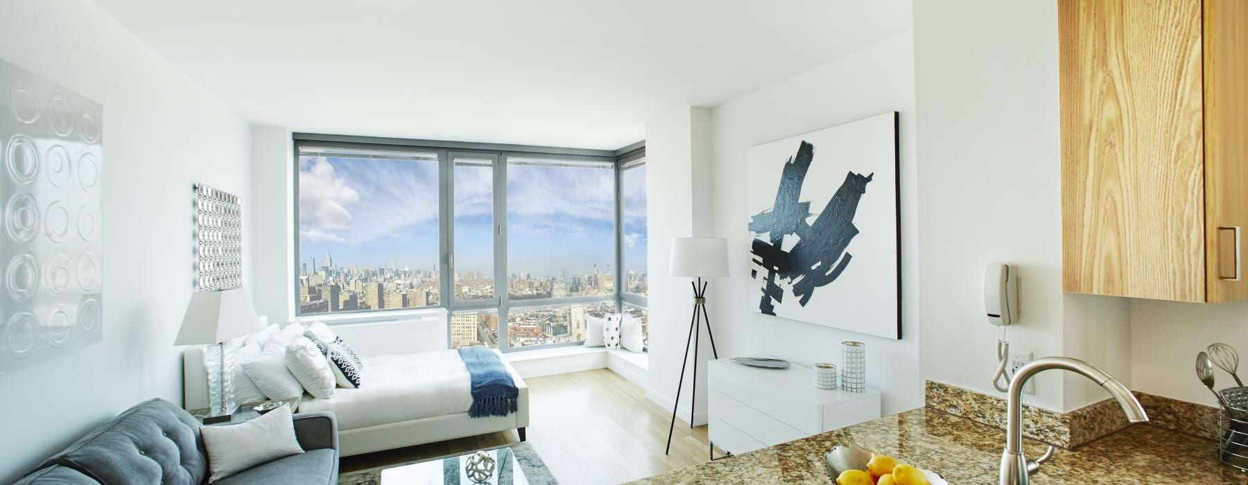 a modern looking bedroom with a large window