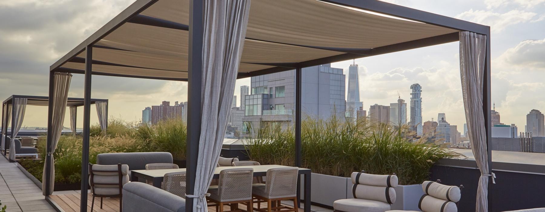 a patio with chairs and a view of a city